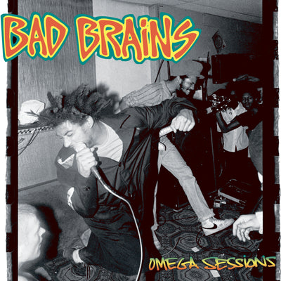 Image of the bad brains omega sessions album artwork. The artwork is a black and white image of the band performing. The singer and guitar player are shown with some fans in the background. The top left of the image says Bad Brains in red lettering and is outlined in yellow and then again in green. The bottom right of the image says omega session in a green, yellow, orange gradient color.