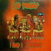 Photo of the Bad Brains- I and I survive album artwork. The background is black and red. The top says Bad brains in red text and is outlined in green. The bottom says I and I survive in red text and is outlined in green. The middle of the artwork features graphics of pyramids, a house, 3 people's faces up close, and 6 men and women playing drums barefoot.