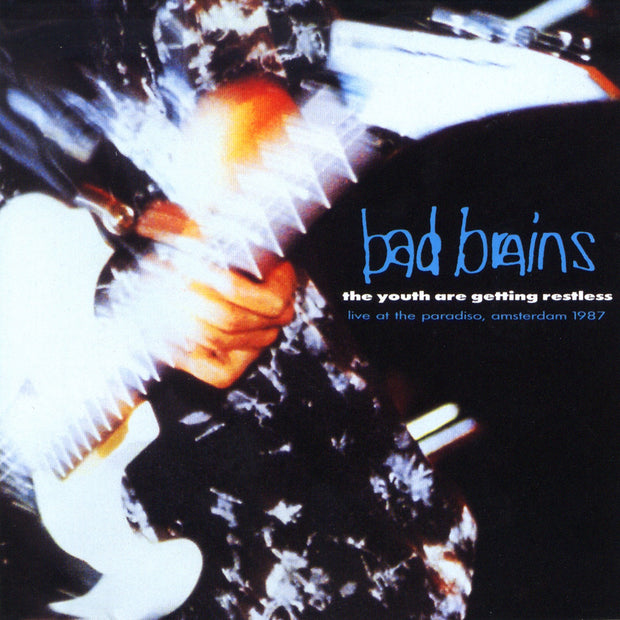 Photo of the bad brains the youth are getting restless (live at the paradise, amsterdam 1987) album artwork. The album artwork is a close up photo of someone playing a guitar, you see their hand and the guitar. The image has a faded and blurred effect to it. The right side of the album artwork says bad brains in blue. Below that in white text says The youth are getting restless. Below that in blue text says live at the paradise, amsterdam 1987.