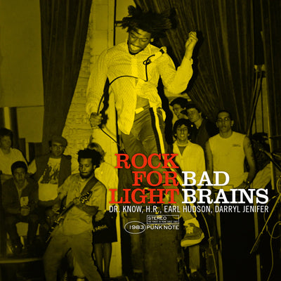 Image of the bad brains- rock for light punk note edition album cover. The album cover is a yellow photograph that shows the band performing for a crowd. The singer is front and center, jumping in the air. The guitarist and fans can be seen in the background. At the bottom of the image in red letters it says rock for light. Next to that in white it says bad brains. Below this in white text it says "Dr. Know, H.R., Earl Hudson, Darryl Jenifer. Below that in white text it says "1983 stereo punk note".