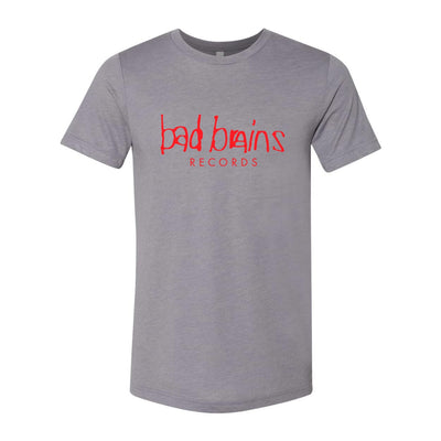 Image of a grey tshirt against a white background. Across the chest in red lettering it says bad brains records. bad brains is on one line in larger text, and records is below it, centered, and in smaller text.