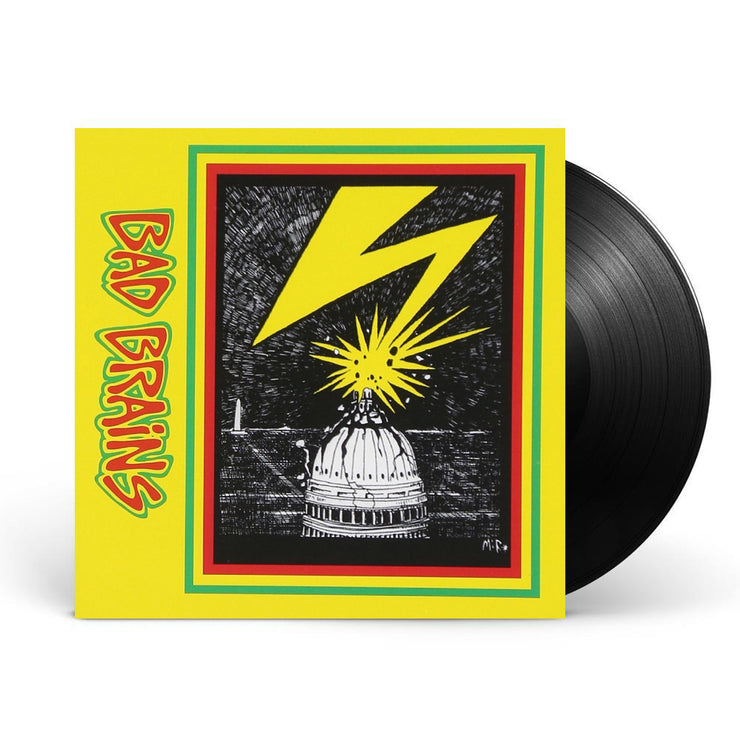 Photo of a vinyl sleeve and vinyl against a white background. The vinyl is solid black. The album sleeve artwork is yellow and on the left side going down the image is a sideways lettering that says Bad Brains. The letters are red and outlined in yellow, and then outlined again in green. On the right side of the artwork is a rectangle with the same red, yellow, green outline. Inside the outlines is a black and white drawn image of the Capitol Building being struck by yellow lightning.