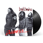 Photo of a the bad brains quickness vinyl sleeve and black vinyl against a white background. The artwork is a black and white image of the 4 band members. two band members on the left look at the camera, not smiling. One has his hands in his pockets while the other does a thumbs up. The third member has his hands in his pockets. The fourth member has his eyes closed as if he is asleep. The top right in black writing with a red outline says bad brains. The bottom left in red writing says quickness.