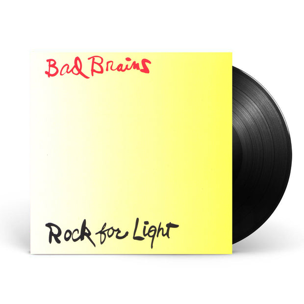 Image of a vinyl sleeve and black vinyl against a white background. The vinyl sleeve is a Photo of the bad brains- rock for light album artwork. The artwork background is a white yellow gradient that starts out white on the left side of the artwork and transitions into a bold yellow. The top of the artwork in red cursive says Bad Brains. The bottom of the artwork in black cursive says rock for light.