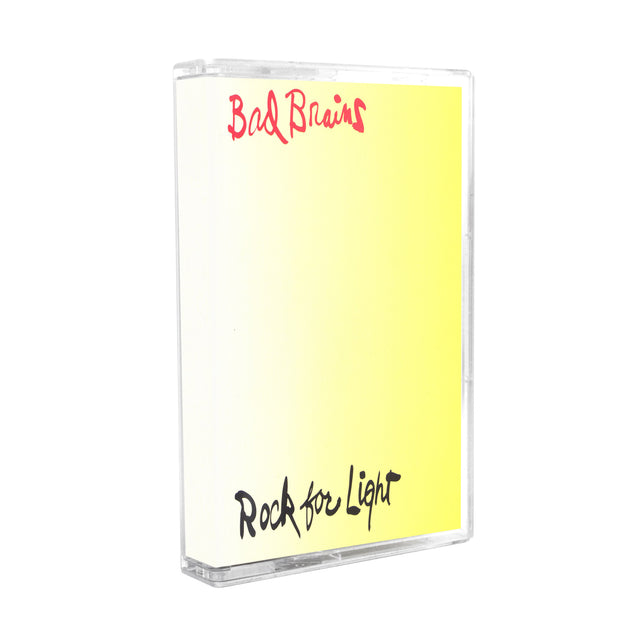 Image of a cassette case against a white background. The case is a photo of the bad brains- rock for light album artwork. The artwork background is a white yellow gradient that starts out white on the left side of the artwork and transitions into a bold yellow. The top of the artwork in red cursive says Bad Brains. The bottom of the artwork in black cursive says rock for light.